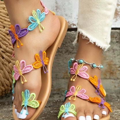 Sandali piatti da donna con farfalle colorate
