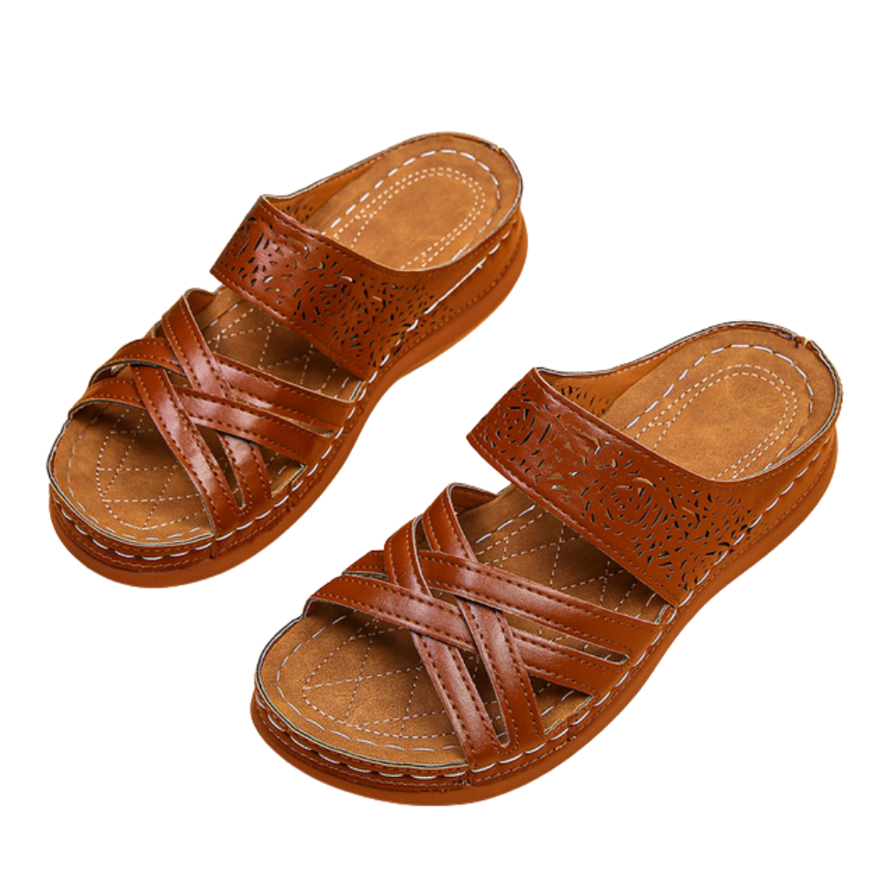 Pantofole con cinturino in pelle incrociata da donna