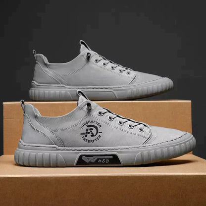 Le scarpe di tela respirano le scarpe da ginnastica da uomo