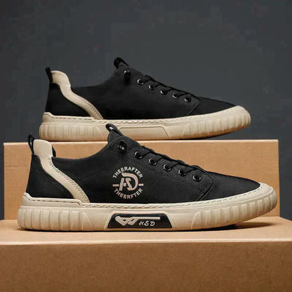 Le scarpe di tela respirano le scarpe da ginnastica da uomo